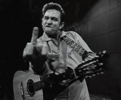 Zdjęcie przedstawiające Johnny Cash. InterpretacjePiosenek.pl - Największa baza interpretacji piosenek w Polsce.