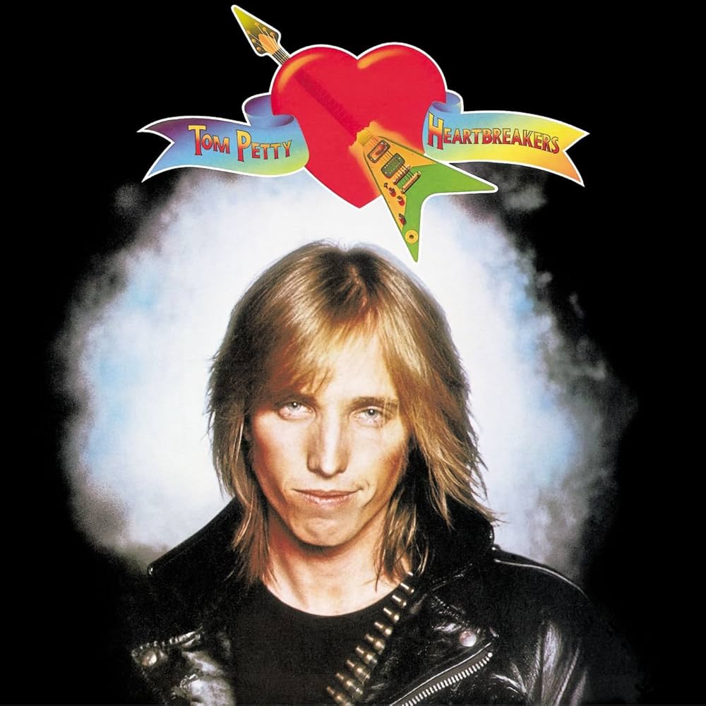 Zdjęcie przedstawiające Tom Petty & The Heartbreakers. InterpretacjePiosenek.pl - Największa baza interpretacji piosenek w Polsce.